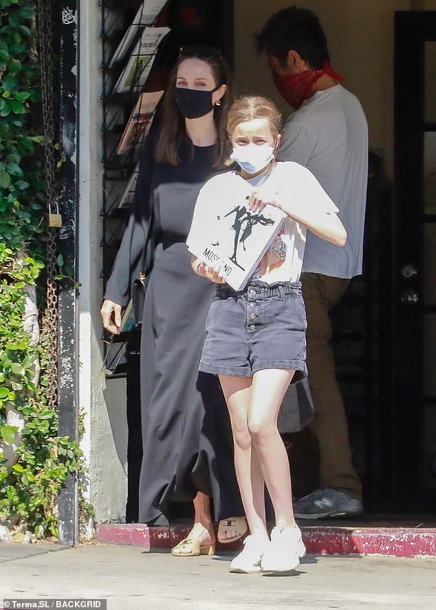 Page turner! Vivienne grabbed a book from the newsstand