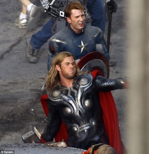 Action heroes: Chris Hemsworth, front, as Thor and Chris Evans as Captain America were united for the first time on the set of the Marvel Comics film The Avengers today in Ohio